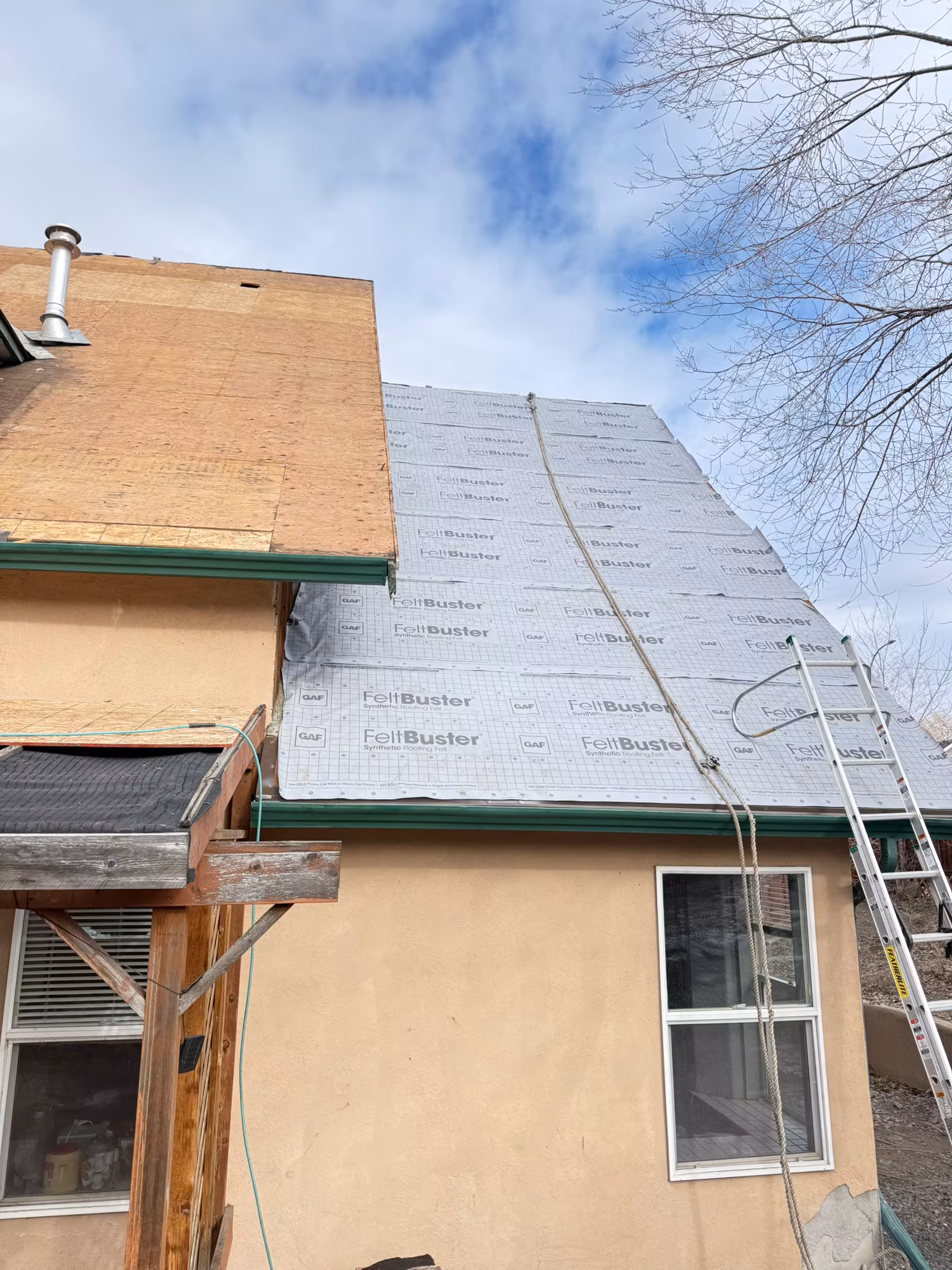 Roof tear-off and replacement with ice and water shield protection in Kelowna.
