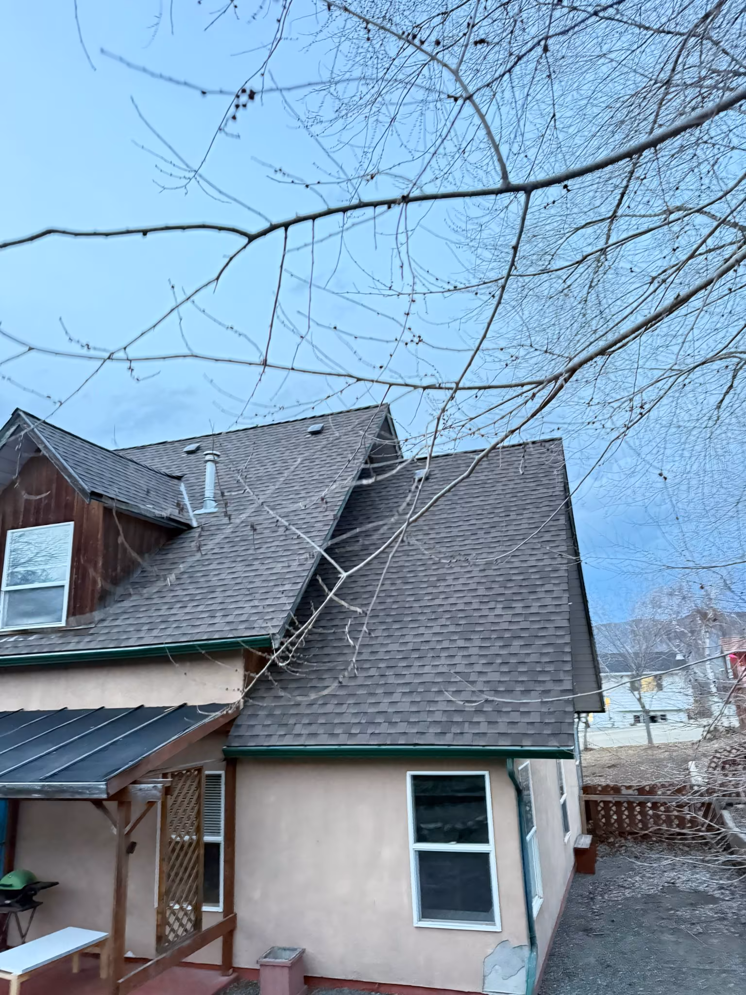 Residential roofing project featuring dark charcoal architectural shingles — West Kelowna