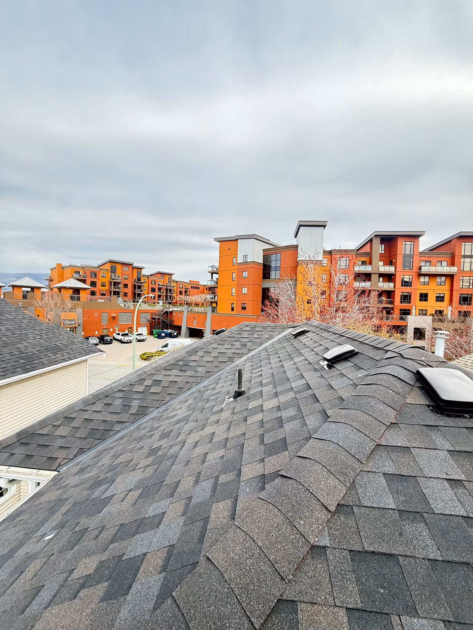 Roofing contractor work in progress showing tear-off and preparation phase — Okanagan