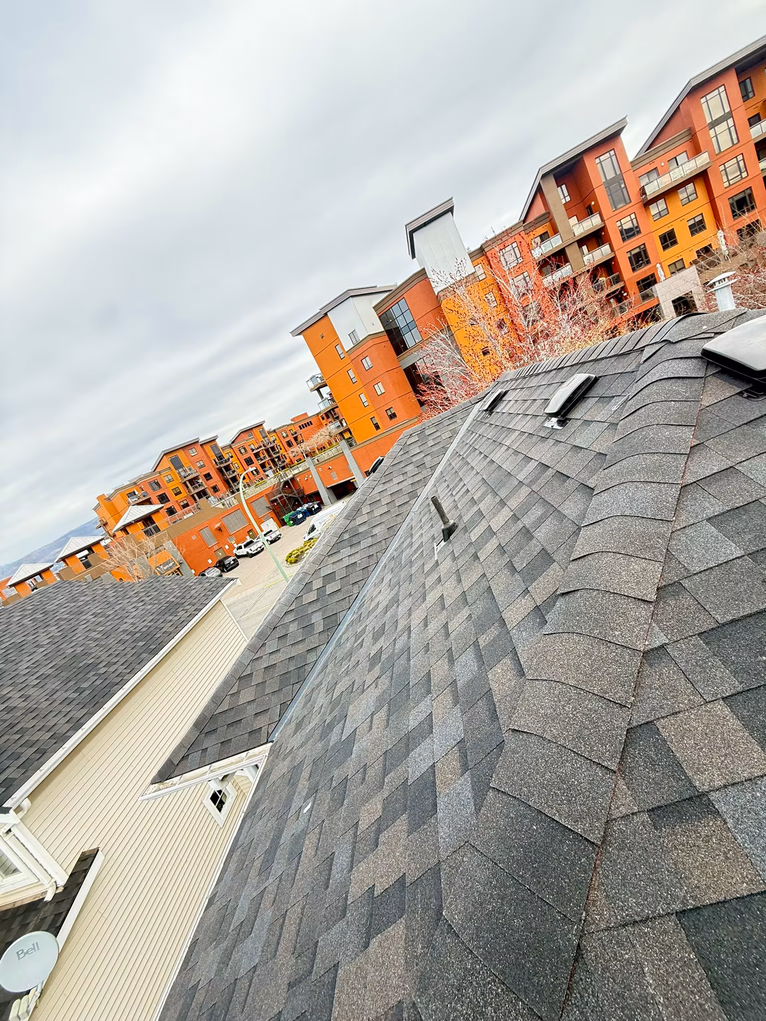 Finished residential roof with premium dimensional shingles and valley metal — Kelowna, BC