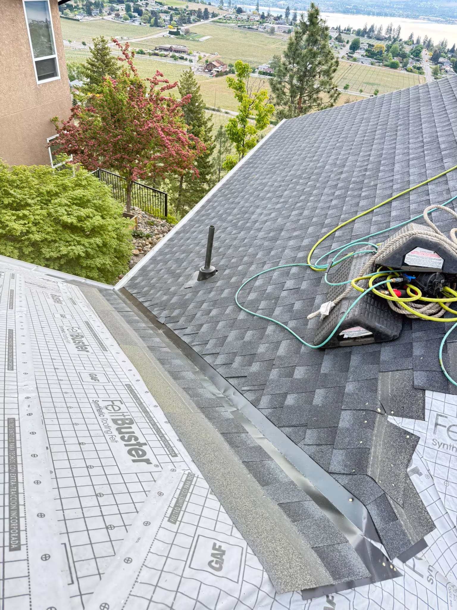 Chimney flashing detail on a West Kelowna roof installation.