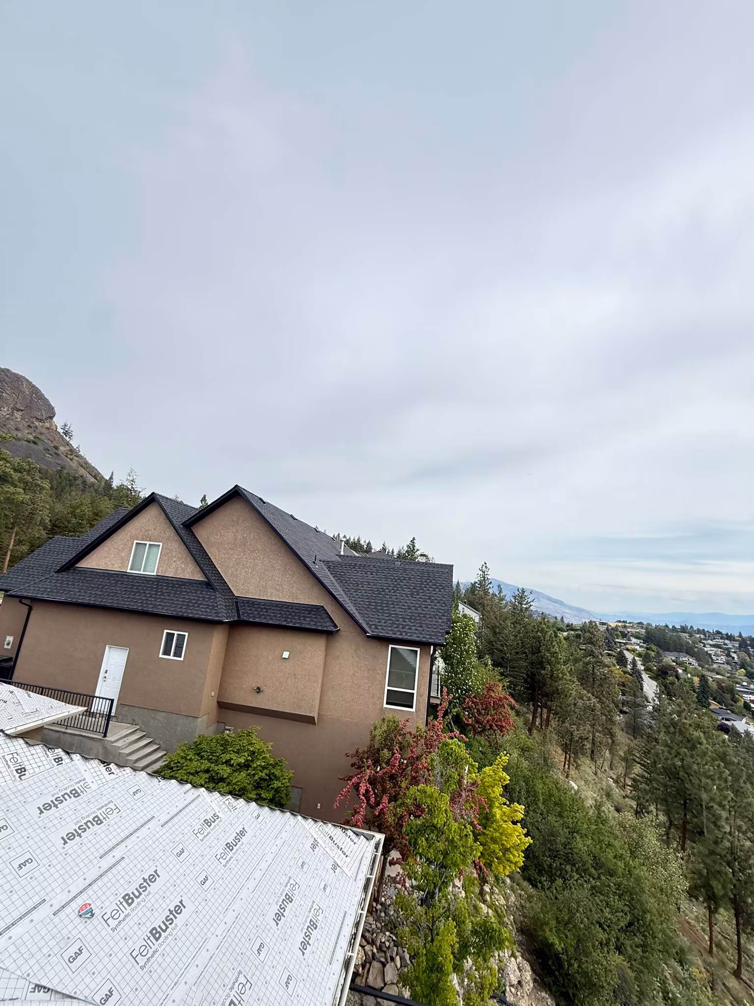 Residential roof with proper eave protection and starter strip installation — Kelowna, BC