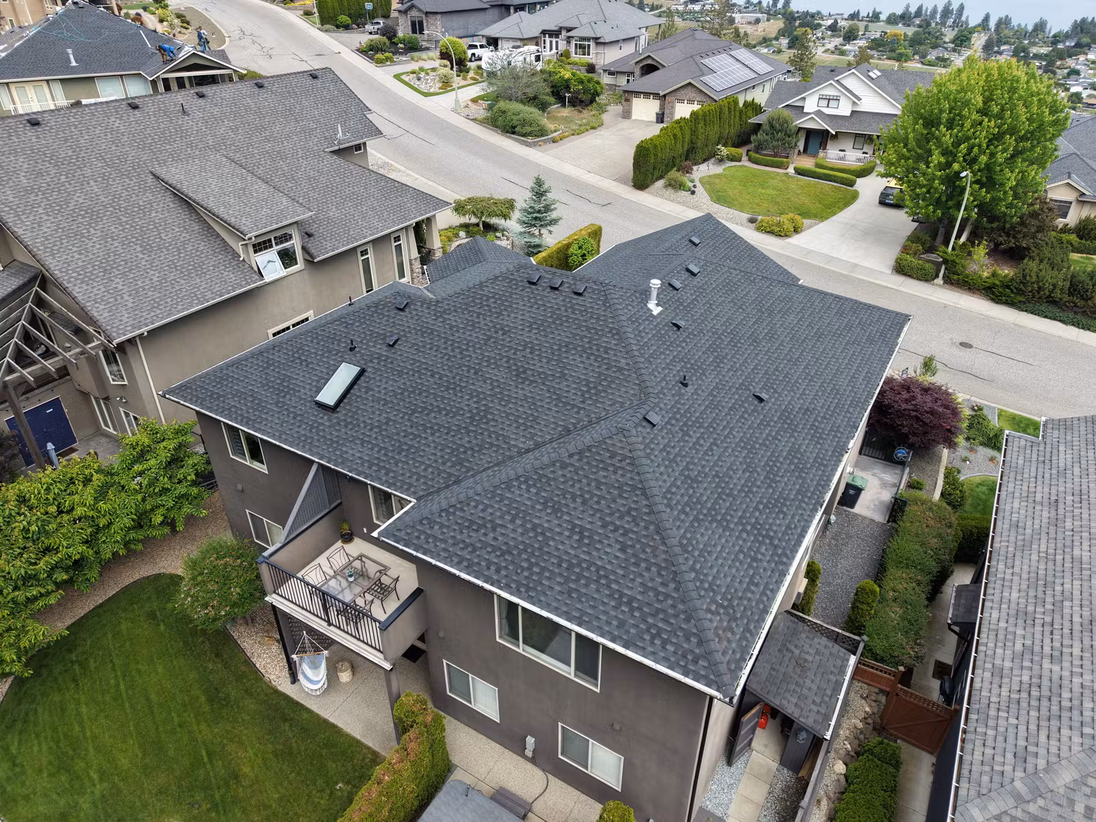 Rear aerial view of a multi-level roof in Lakeview Heights