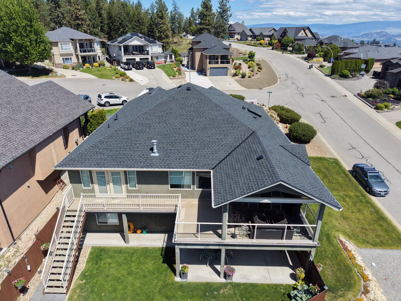 Rear aerial view of an architectural shingle roof in West Kelowna